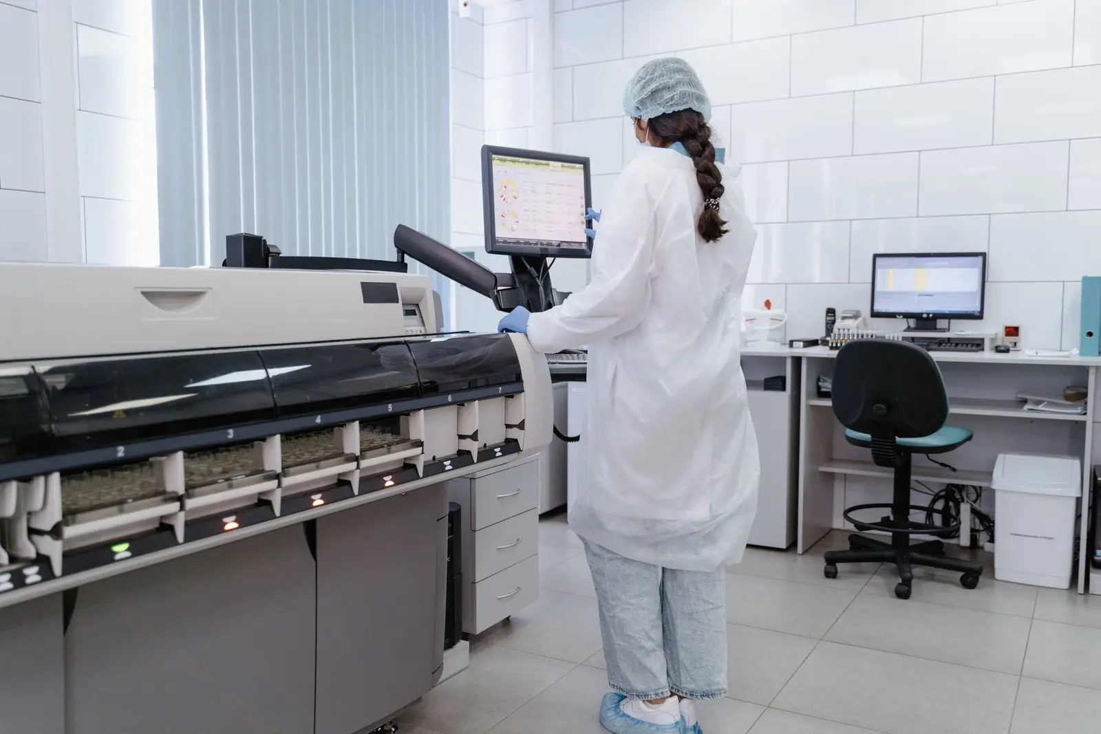 Representative laboratory professional using medical equipment